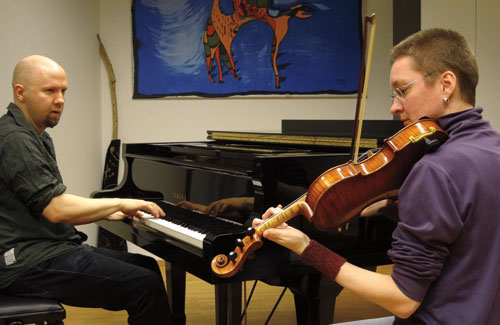 Juha and lydia play piano and fiddle at the Sibelius Academy in Helsinki