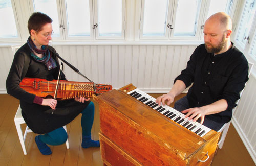 lydia and Juha play nyckelharpa and harmonium during recording in Finland
